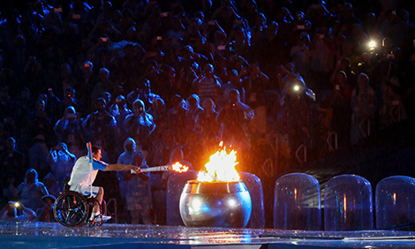 Brazilian swimmer Clodoaldo Silva lights the Paralympic flame